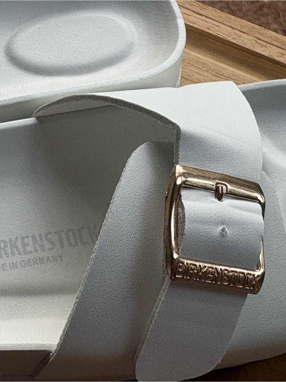 White Birkenstock Madrid Big Buckle EVA sandals with gold-toned buckles. - Picture 2 of 9